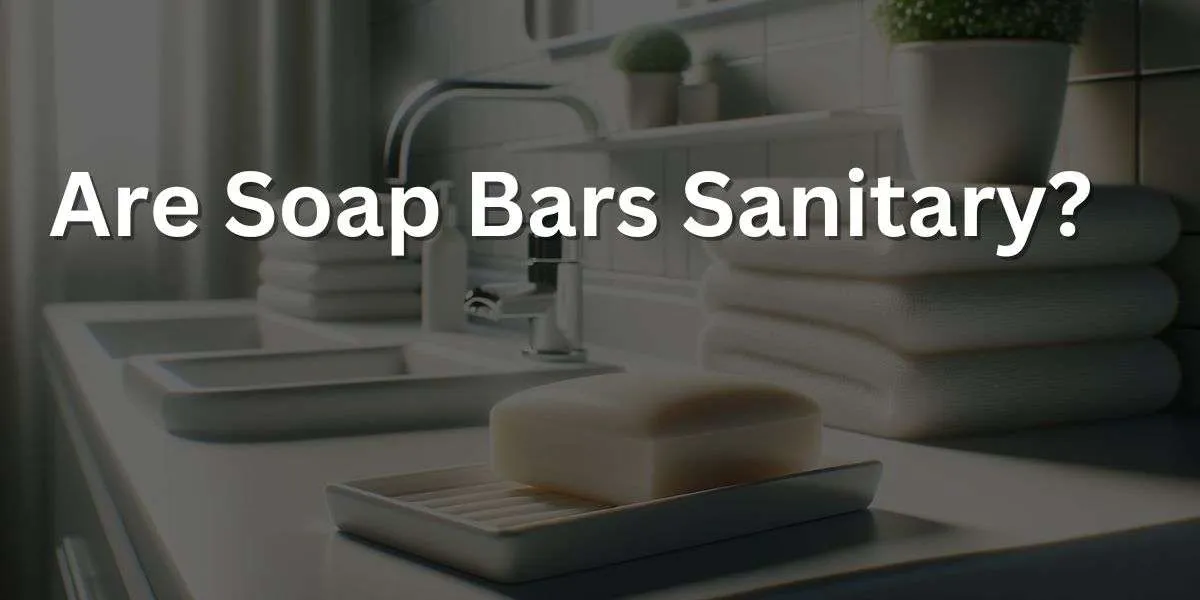 image showcasing a spotless white bathroom counter that highlights the theme of cleanliness. Various soap bars are neatly presented on individual soap dishes with drainage, suggesting orderly maintenance. A prominently displayed soap bar in the foreground has a sharp, clean cut and a flawless surface, signifying its unused, sanitary condition. In the soft-focus background, crisp white towels are precisely folded, and a lush potted plant introduces a touch of nature, enhancing the sense of purity and attentive upkeep. The area is illuminated with bright, uniform lighting that casts no shadows, reinforcing a clean, bacteria-free setting. This visual conveys the message that soap bars are a clean and hygienic option for personal hygiene.
