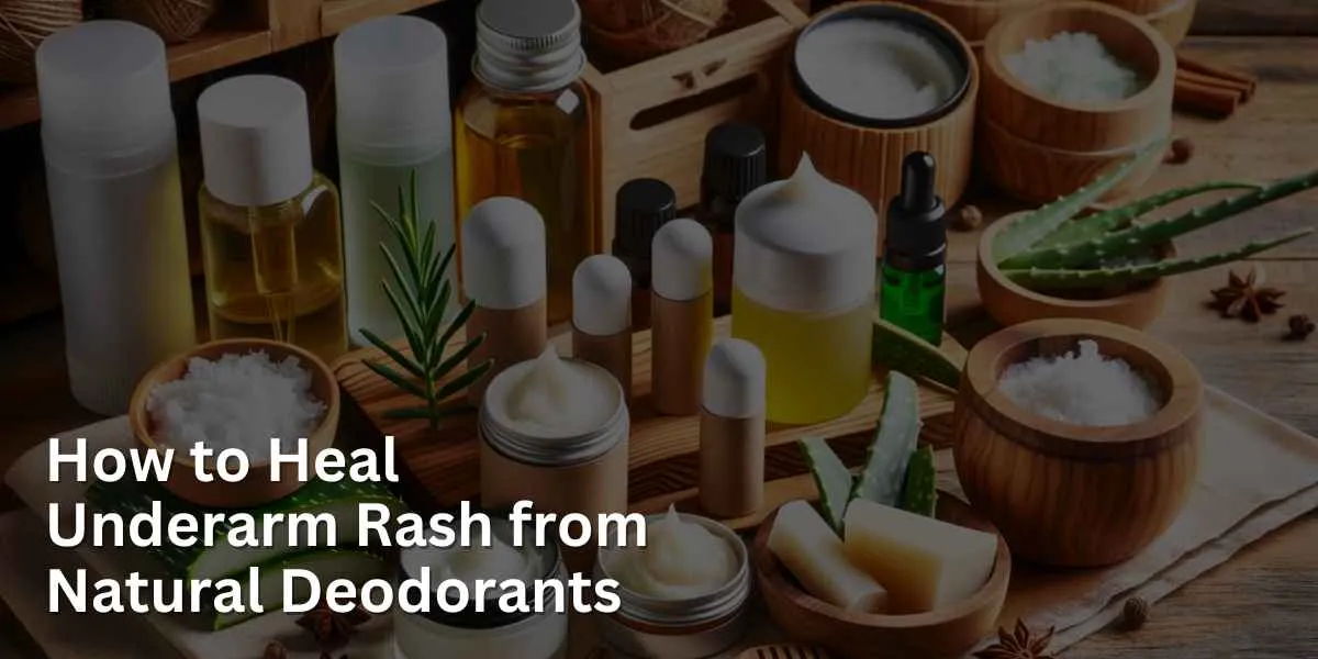A collection of natural deodorants is arranged on a wooden shelf. The assortment includes stick deodorants, roll-ons, and jars of cream. In the background, ingredients like aloe vera, coconut oil, and essential oils are visible, suggesting their use in these products.