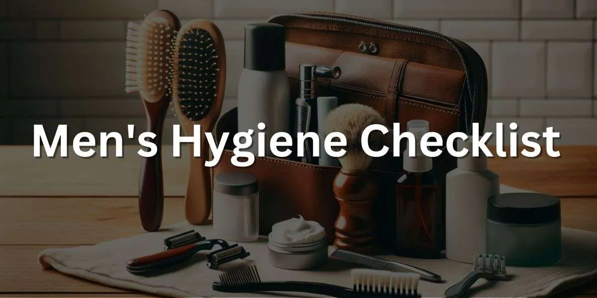A neatly organized men's hygiene and grooming kit on a wooden table. The kit includes a razor, shaving cream, a hairbrush, deodorant, toothbrush, toothpaste, and a small bottle of cologne. The background is a simple, clean bathroom setting with white tiles.