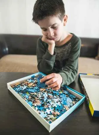 Children Excited About Doing Puzzles