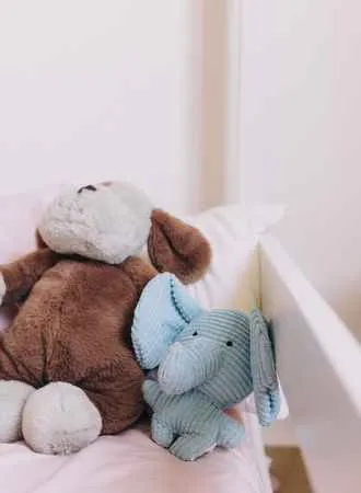 stuffed animals in the bed
