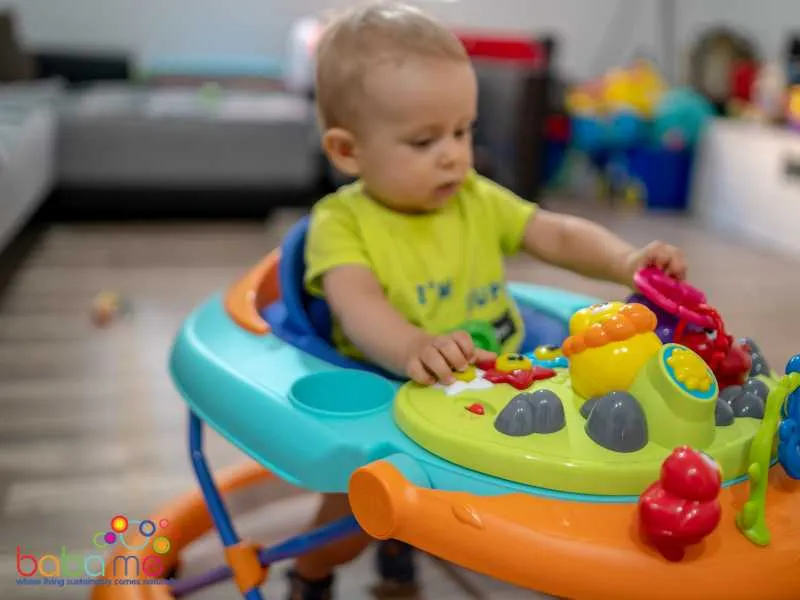 child playing on baby walker
